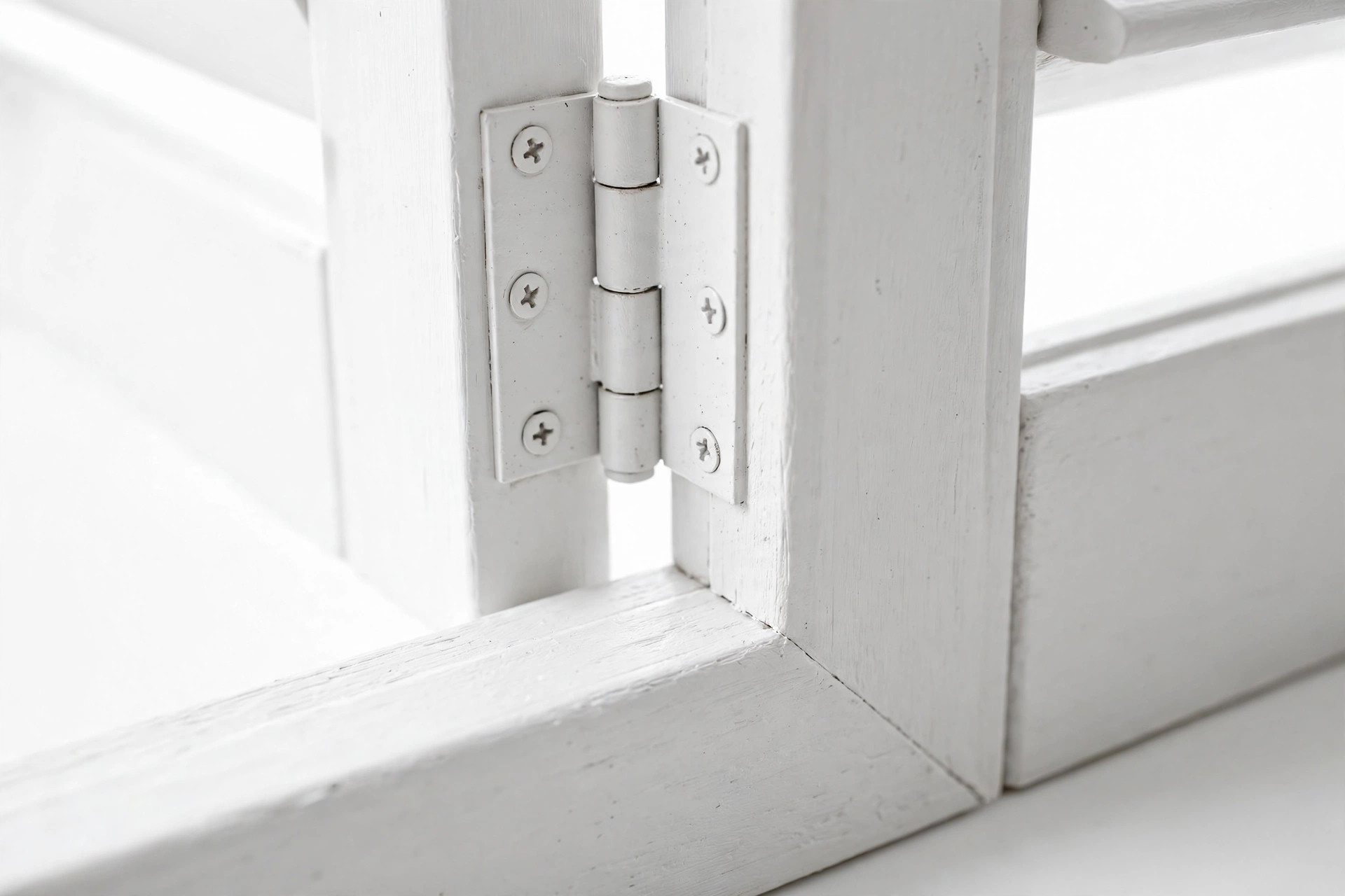 Close-up of shutter panel hinge hardware used in DIY installation